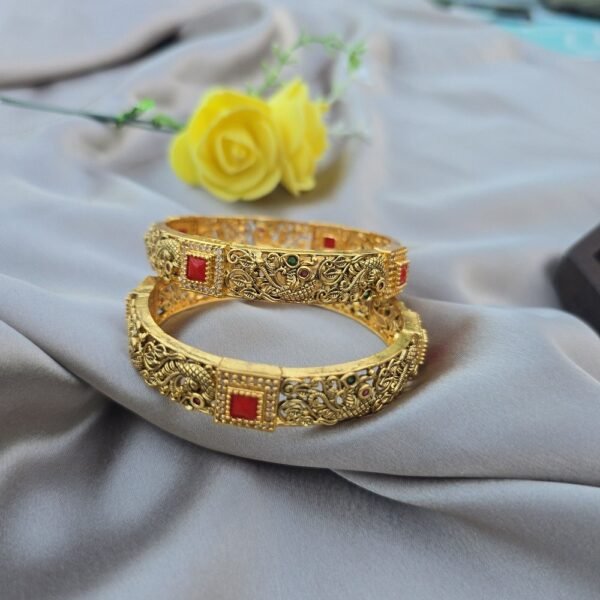 A Pair Of Peacock Coral Bangles - Image 2