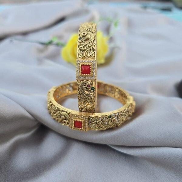 A Pair Of Peacock Coral Bangles